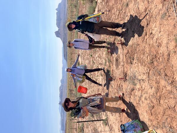 four people smile in a southern Utah landscape