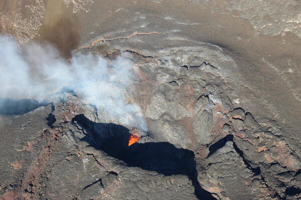 Color photograph of lava spattering in vent