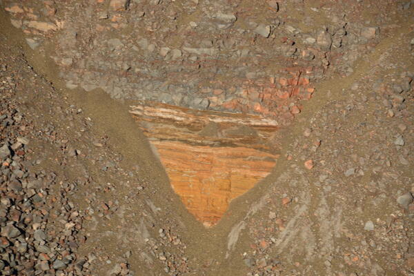 Color photograph of ash in caldera wall