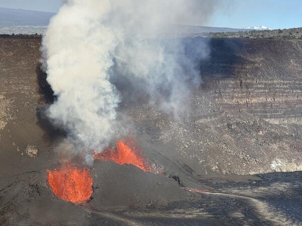 Color photograph of vents erupting lava