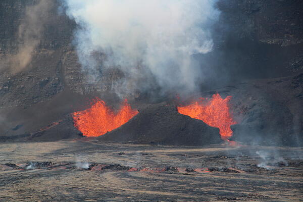Color photograph of vents erupting lava