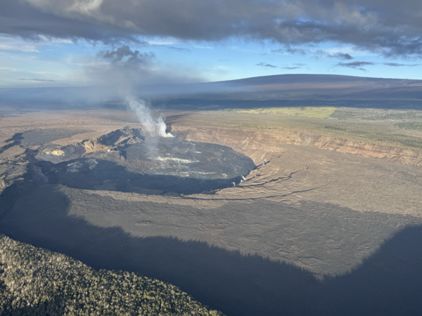 Color photograph of crater at summit of volcano 