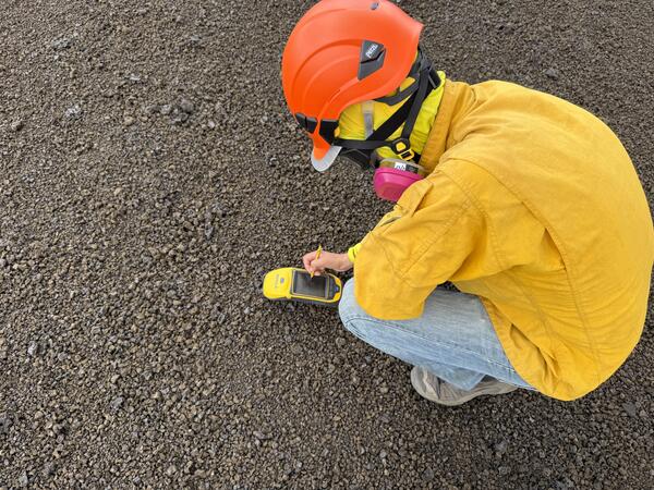 Color photograph of scientist taking GPS measurement