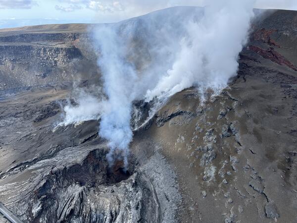 Color photograph of volcanic vent degassing