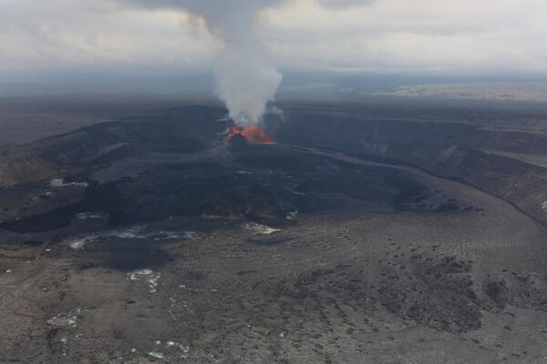 Color photograph of eruption within crater