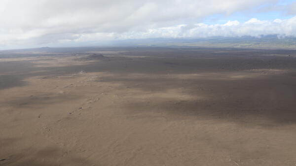 Color photograph of tephra blanketed landscape