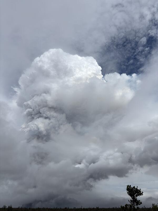 Color photograph of eruptive plume