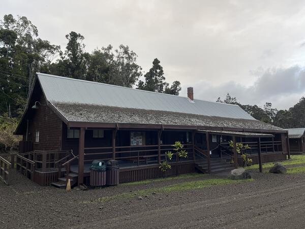 Color photograph of roof partially covered with volcanic fallout