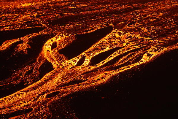 Color photograph of lava channels at night