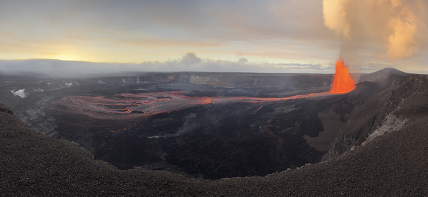 Color panoramic photograph of volcanic eruption within crater