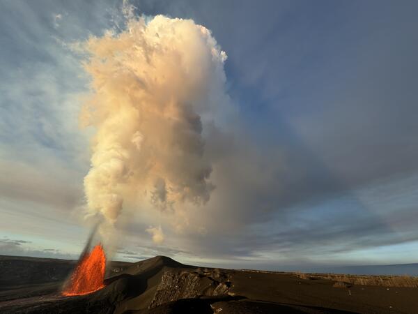 Color photograph of lava fountain and volcanic plume