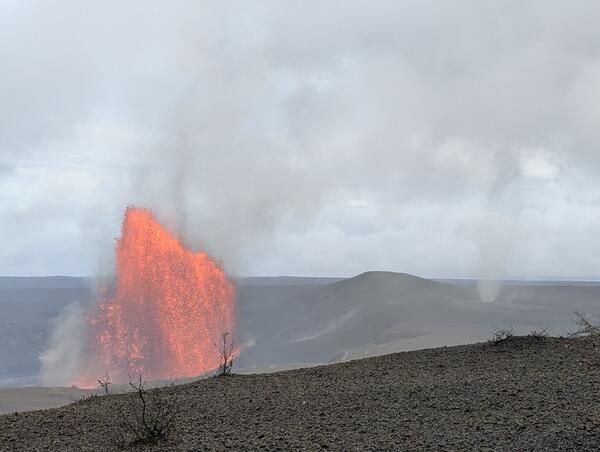 Color photograph of lava fountain and whirlwind