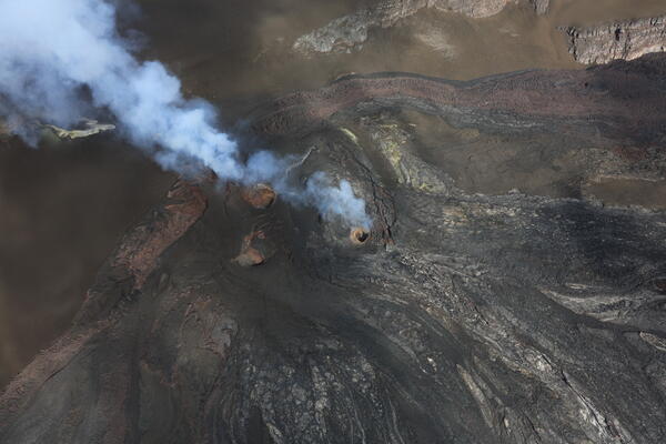 Color photograph of volcanic vents degassing