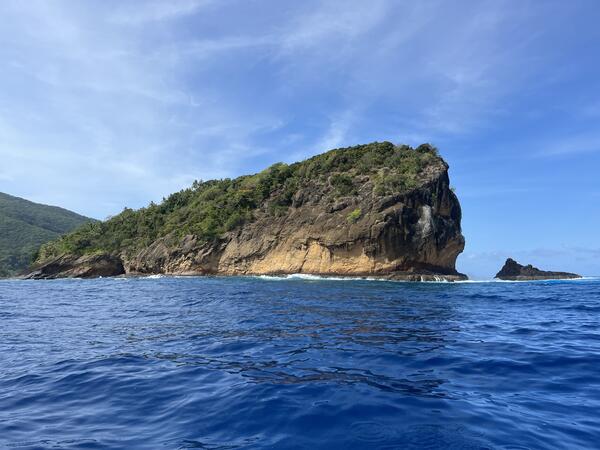 Color photograph of island rising from ocean