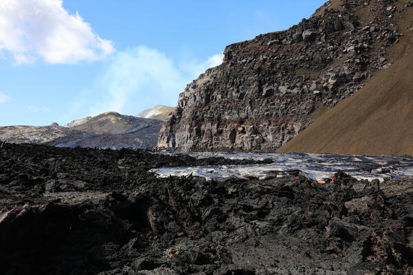 Color photograph of lava flow near crater wall