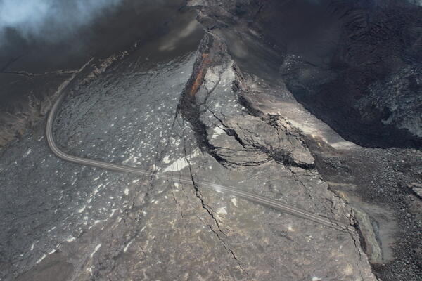 Color photograph of crater rim with road