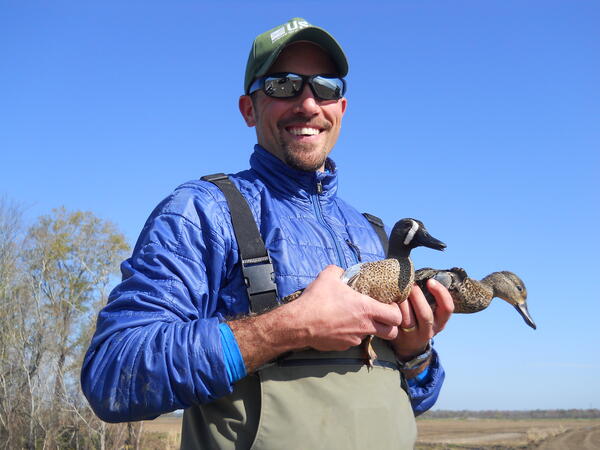 Andy Ramey holding two ducks