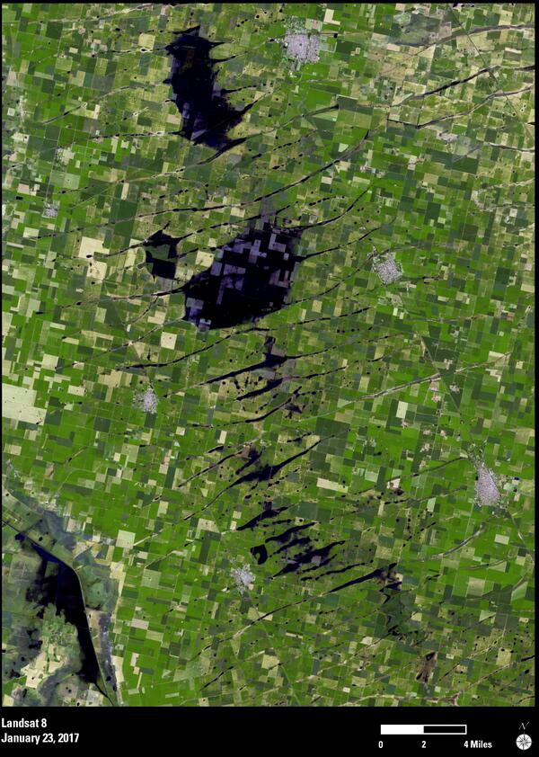 This image shows a satellite view of flooding in squares of farmland in Argentina