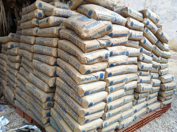 Image shows a pallet of bags of cement