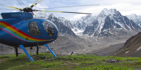 Blue Helicopter with painted rainbow waiting to pick up geologic mappers and move them to a new location in the western Alaska Range in south-central Alaska