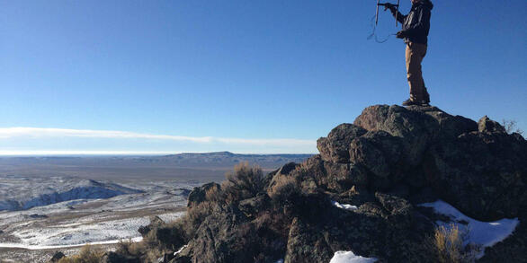Graduate student listening for signals from wildlife collars