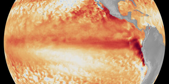 Map of Pacific Ocean showing sea surface temperatures in mostly oranges and reds