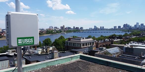View of air sampler with USGS logo sticker, overlooking city of Boston