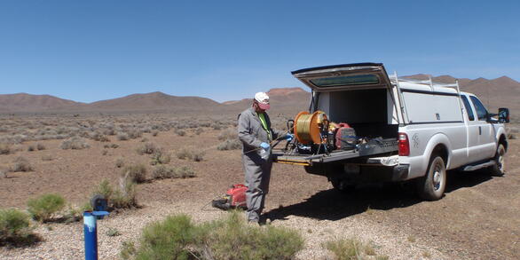 Hydrologist measuring depth to water in well UE­17a, Nevada National Security Site, Nevada