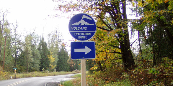 Volcano Evacuation Route sign along a roadway in Washington State. ...