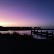 A purple sunrise at Bayou Heron boat ramp in the Grand Bay National Estuarine Research Reserve