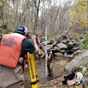  This photo shows USGS researchers Kyle Fronte and Karli Rogers measuring stream flow.