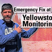 Thumbnail image of a man gesturing towards trees in the background