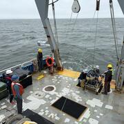 People working on a ship at sea