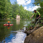 Eric Boyd pulls an Acoustic Doppler Current Profiler across a river.