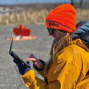Researcher prepares a wingtra lidar flight at the Darby Creek landfill Superfund site 