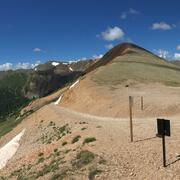 mountain with snow patch on ground