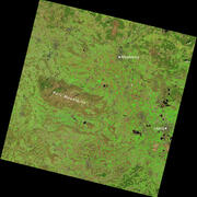 a satellite image showing shades of brown and green