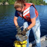Graduate student working on a lake sturgeon project