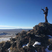 Graduate student listening for signals from wildlife collars