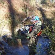 Postdoctoral Researcher Robert Paine collecting environmental DNA from Little Chucky Creek, Tennessee
