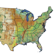 A map of the United States with varied shades of greens, browns, blues, and red, and the states outlined in black