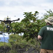 USGS scientist flying a UAS at the Puʻuhonua o Hōnaunau National Historical Park