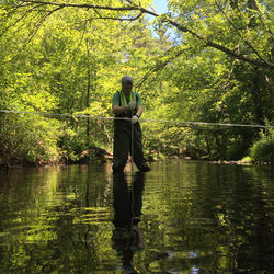 USGS Technician using a sampler to collect discrete water-quality samples