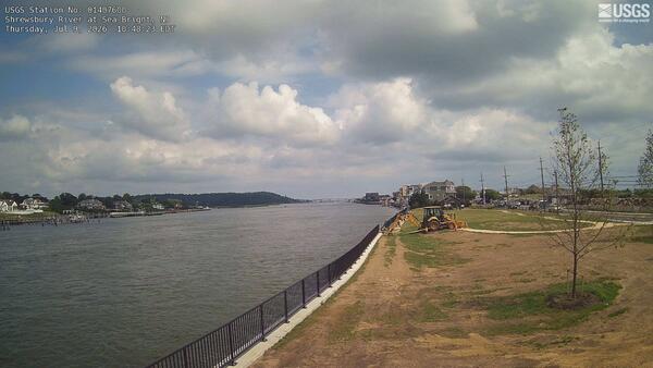 Looking downstream along a riverbank and along the river