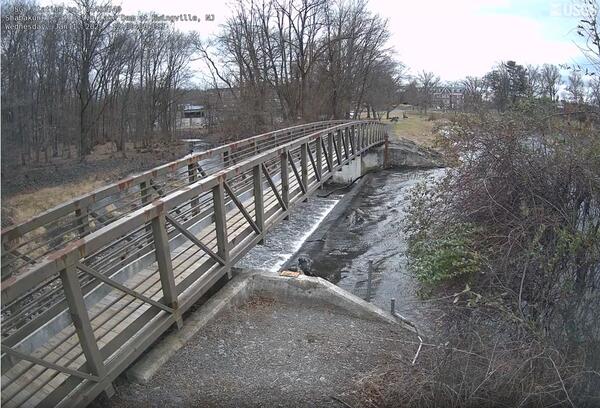 View along a footbridge spanning the outflow from Sylva Lake 