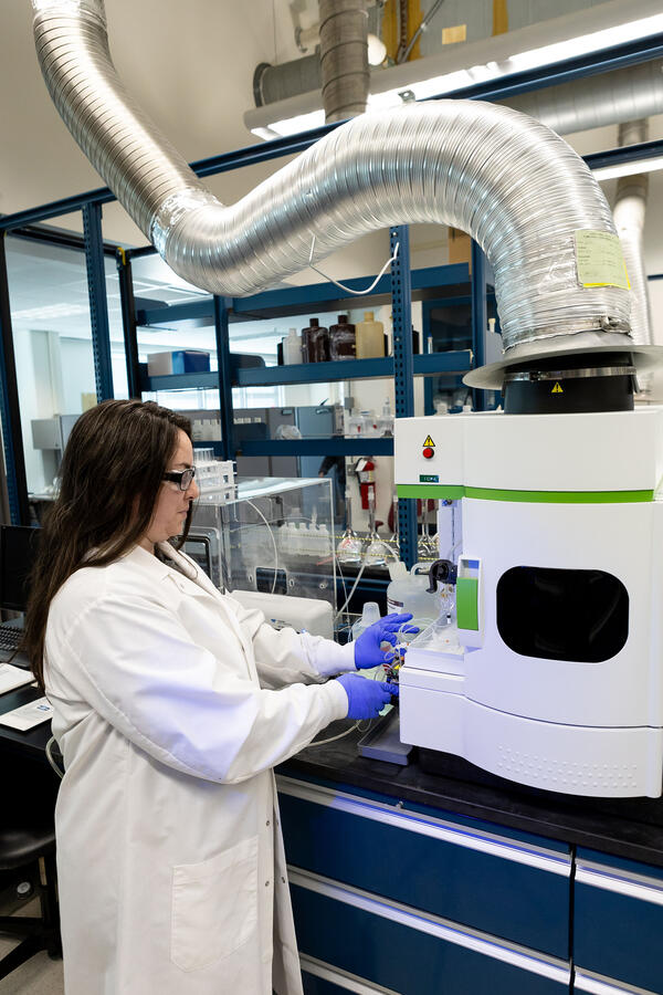 scientist using a water chemistry analyzer
