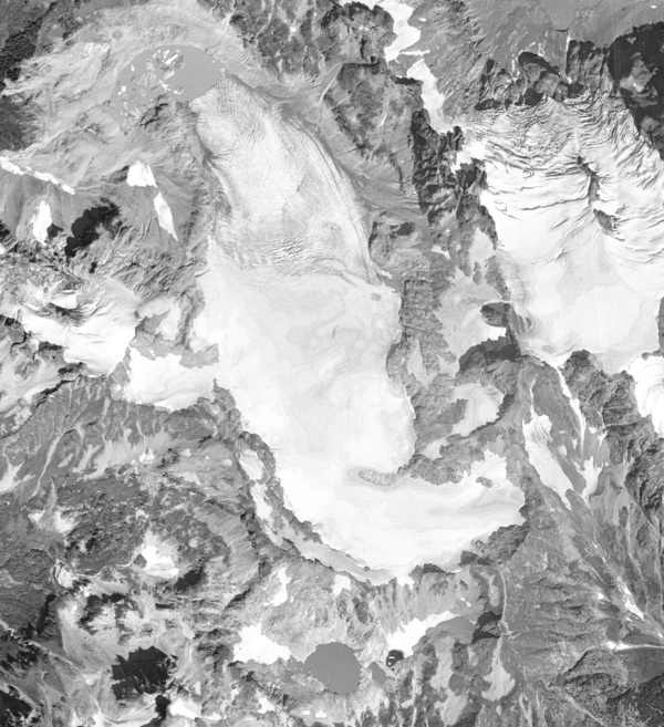 Black and white aerial view of a glacier.