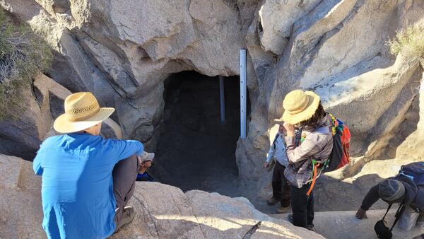 USGS surveyors outside of a water catchment in Cabeza Prieta National Wildlife Refuge, AZ