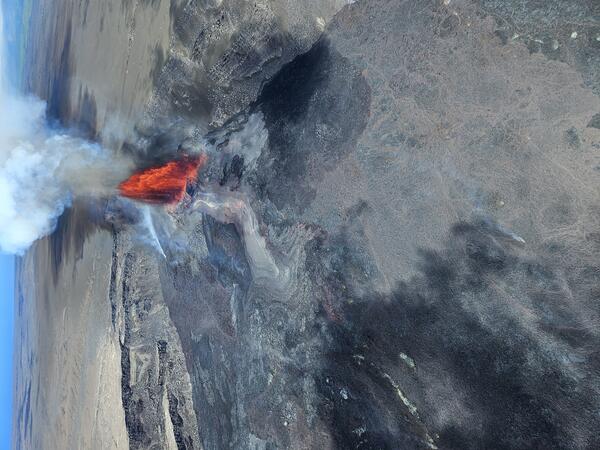 Color photograph of lava fountain in crater