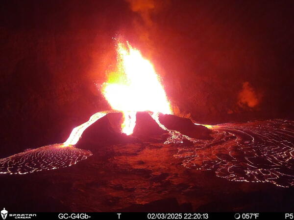 Color photograph of lava erupting from vent